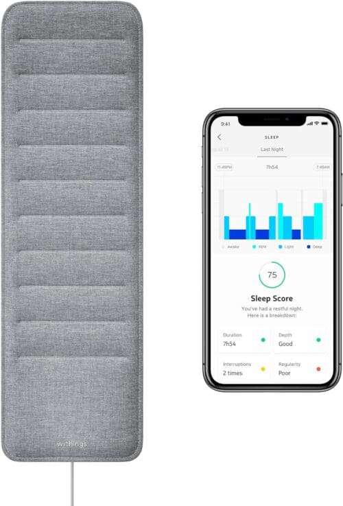 Withings Sleep tracking pad under the mattress with sleep cycle analysis app displayed on smartphone.
